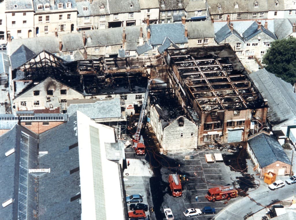 An aerial photograph showing the aftermath of the Bridge Street Mill fire