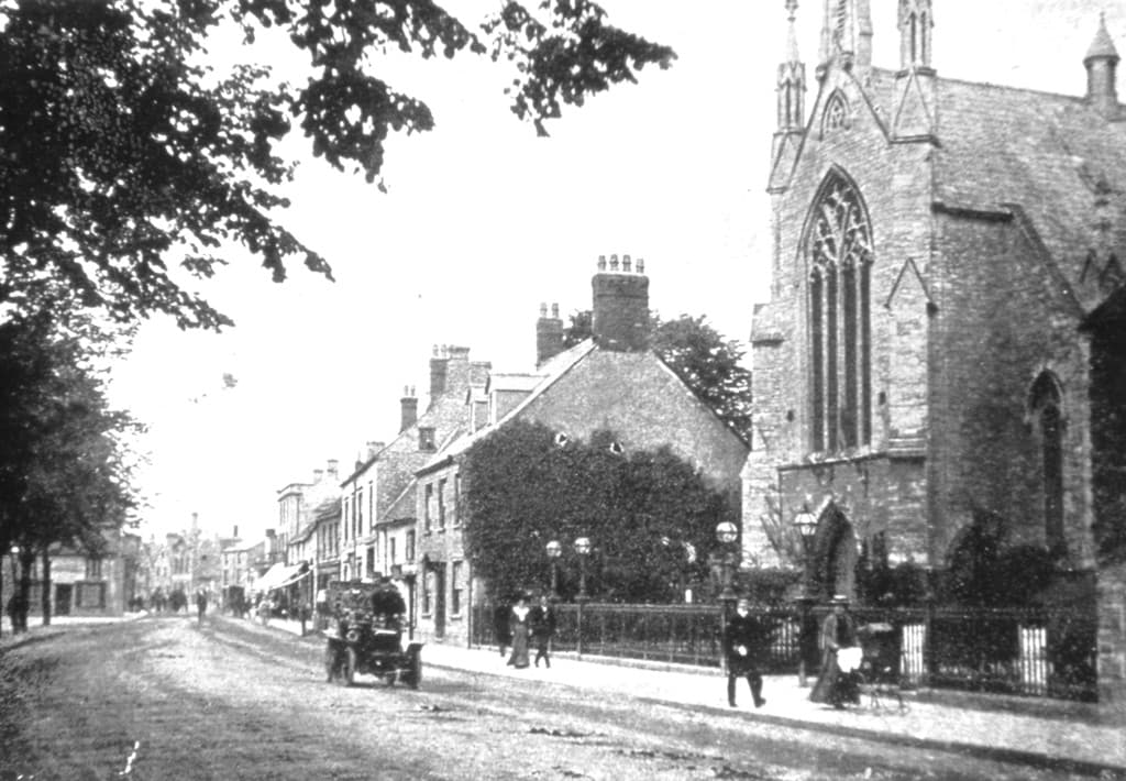 A black and white postcard view of the High Street showing the Wesleyan Methodist chapel circa 1912