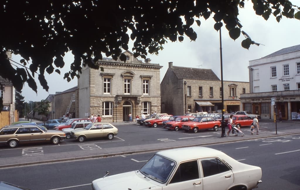 A colour photo showing the Corn Exchange and other buildings in Market Square in 1983